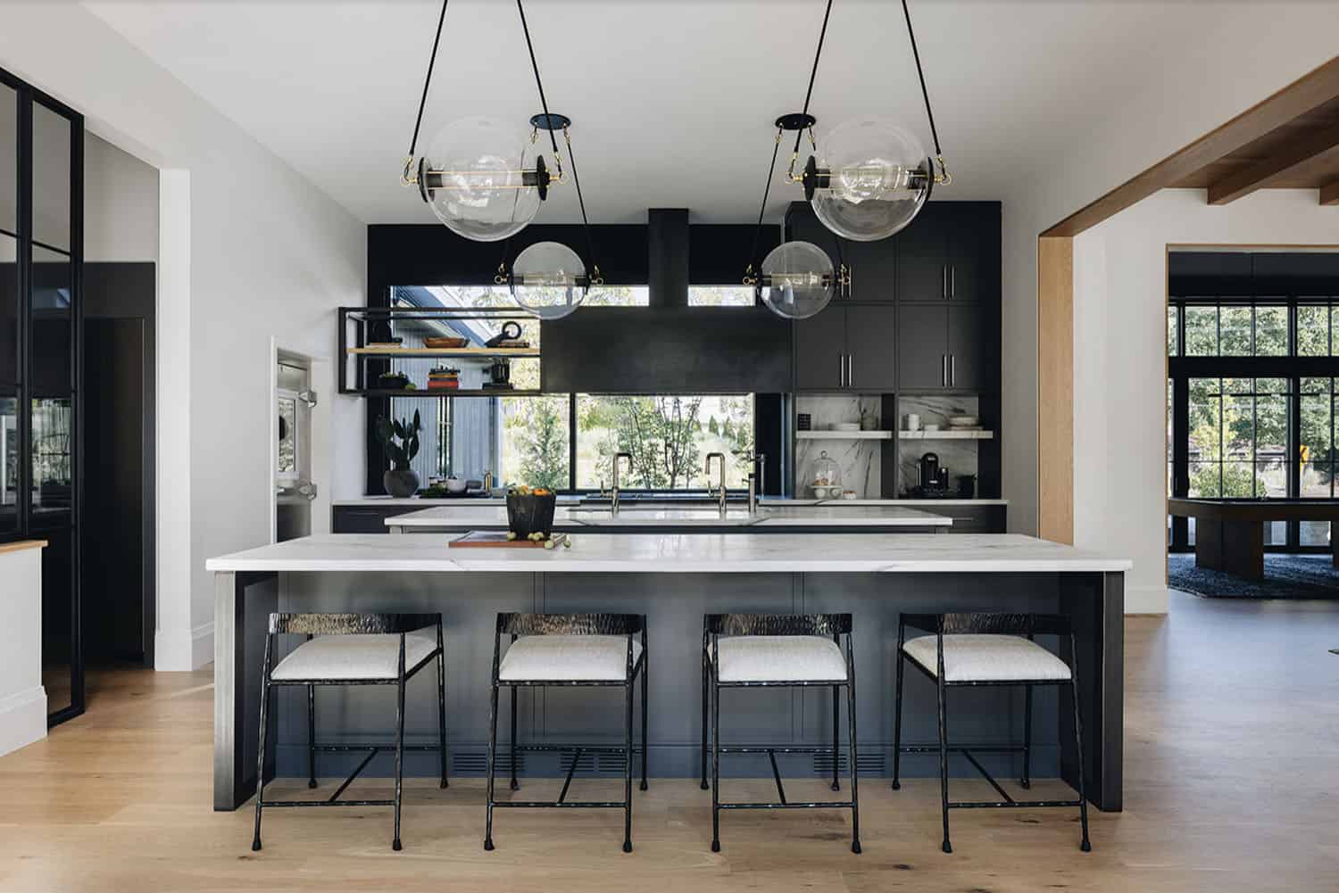 transitional kitchen with large pendant lights