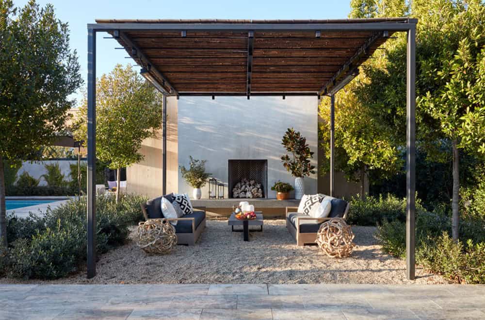 urban farmhouse exterior with a fireplace and pergola