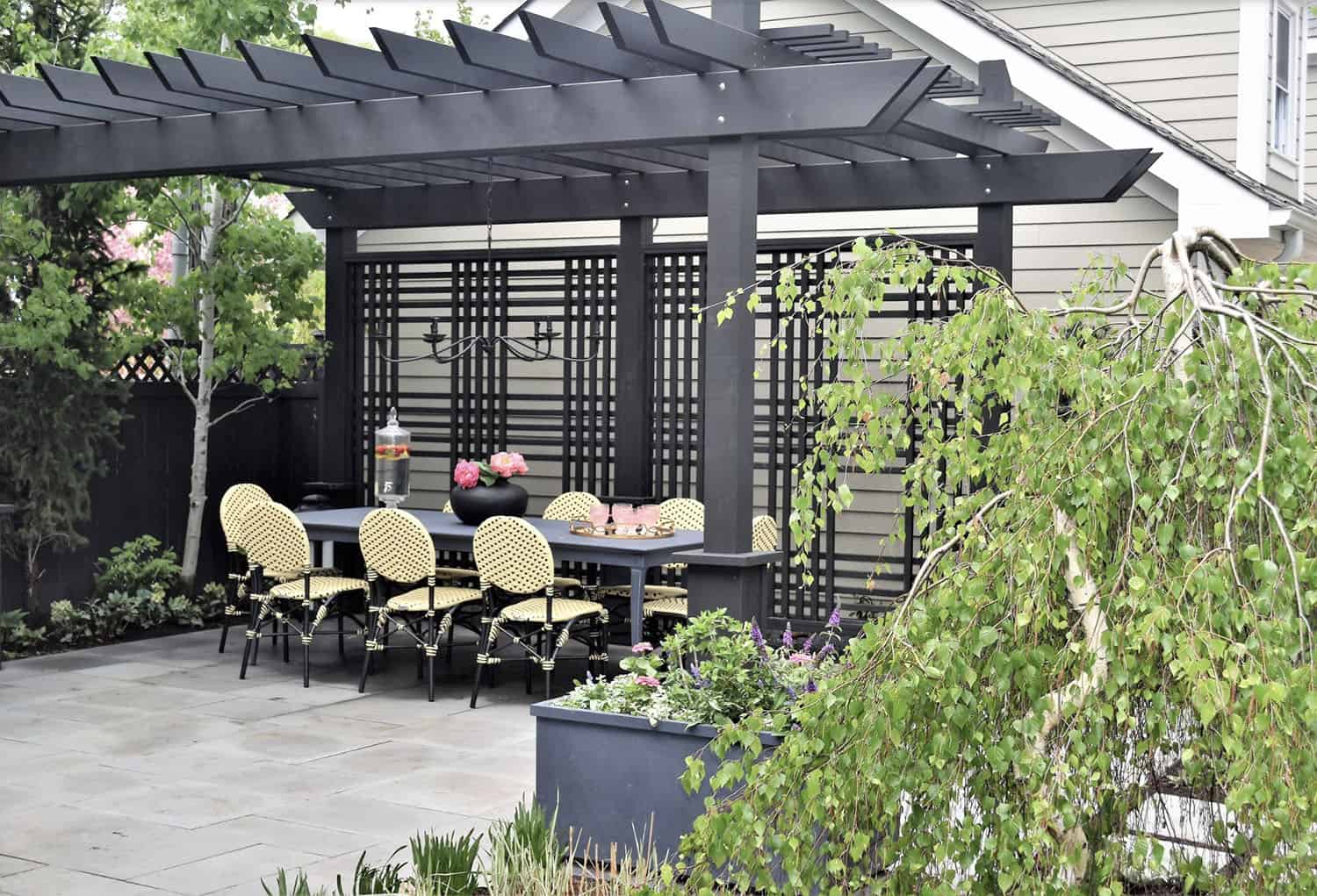 bluestone patio with a pergola and alfresco dining