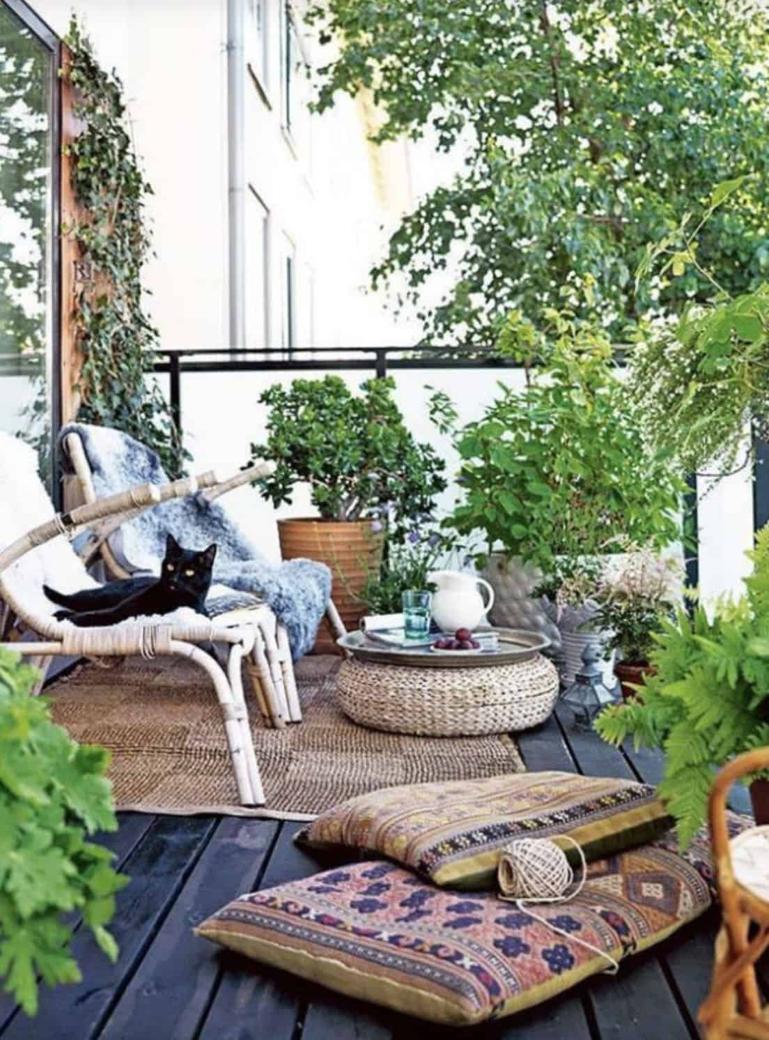 contemporary balcony with chairs, cushions and container plants