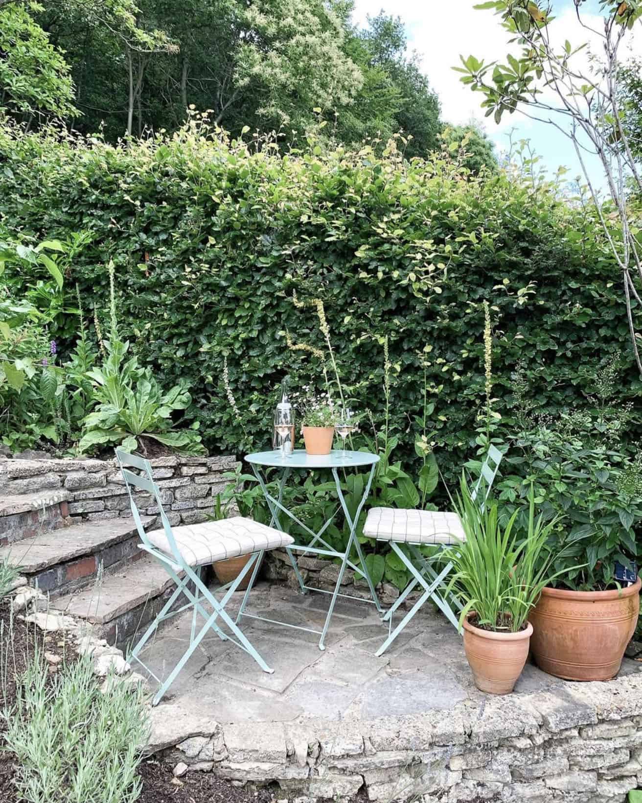 small patio surrounded by a garden