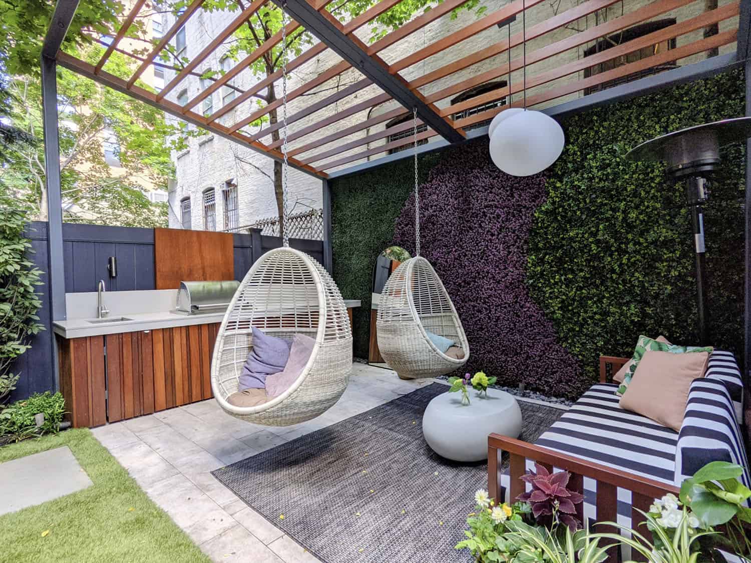 Backyard with slanted pergola and a green wall