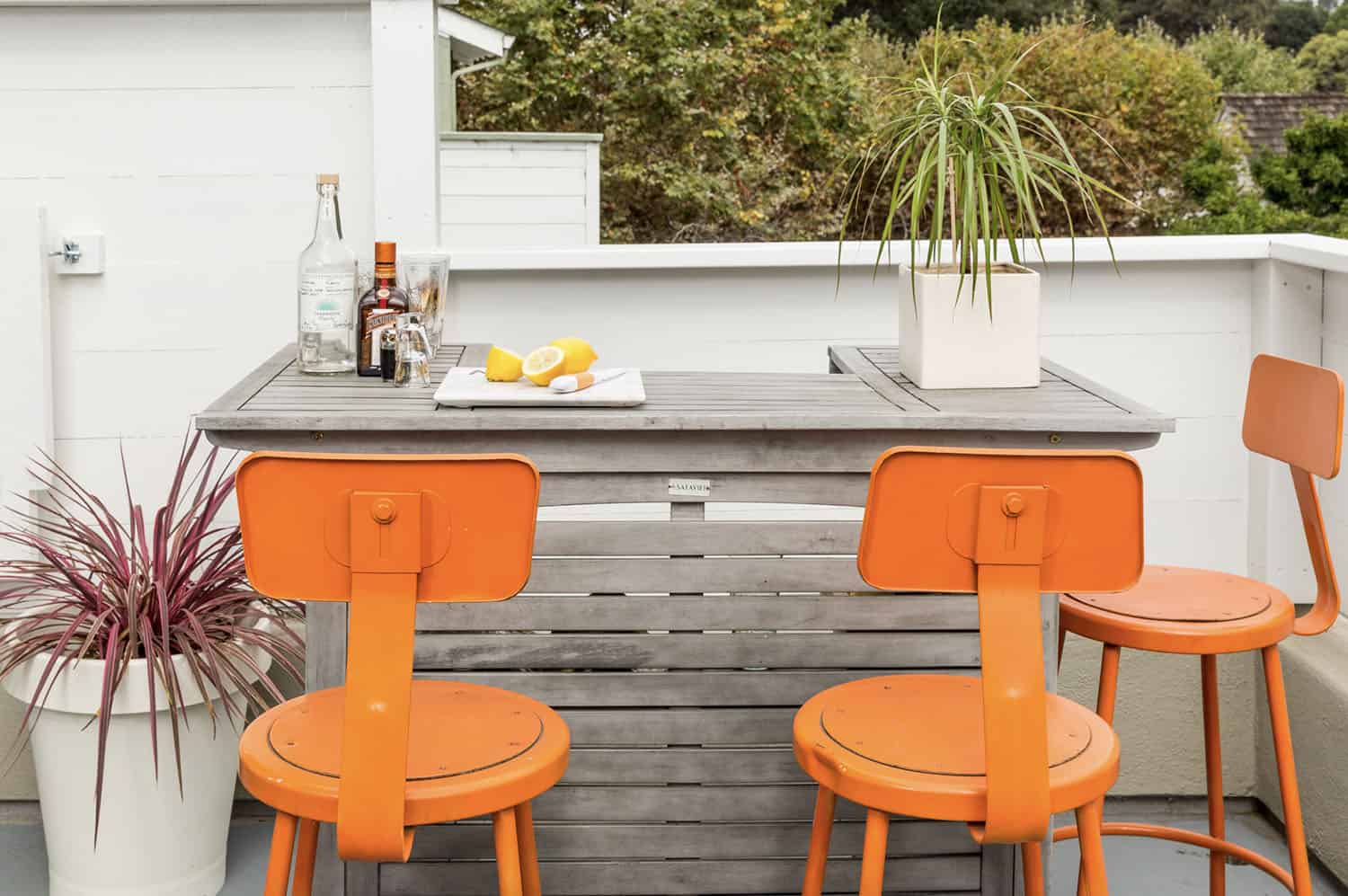 outdoor bar with antique orange chairs