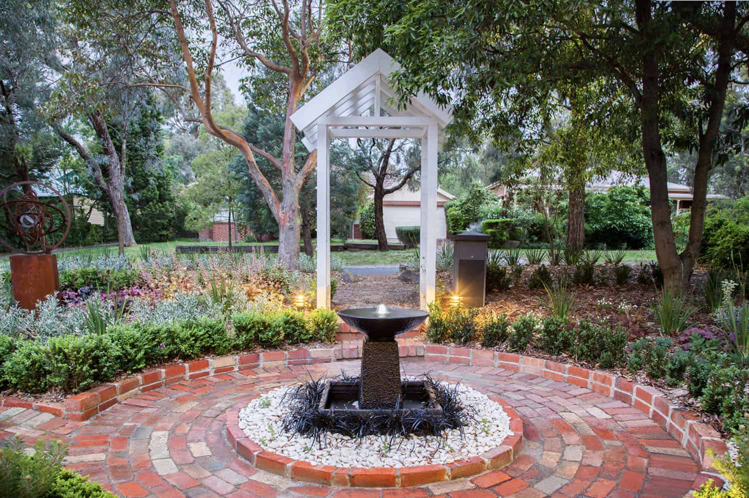 circular brick border around a water feature