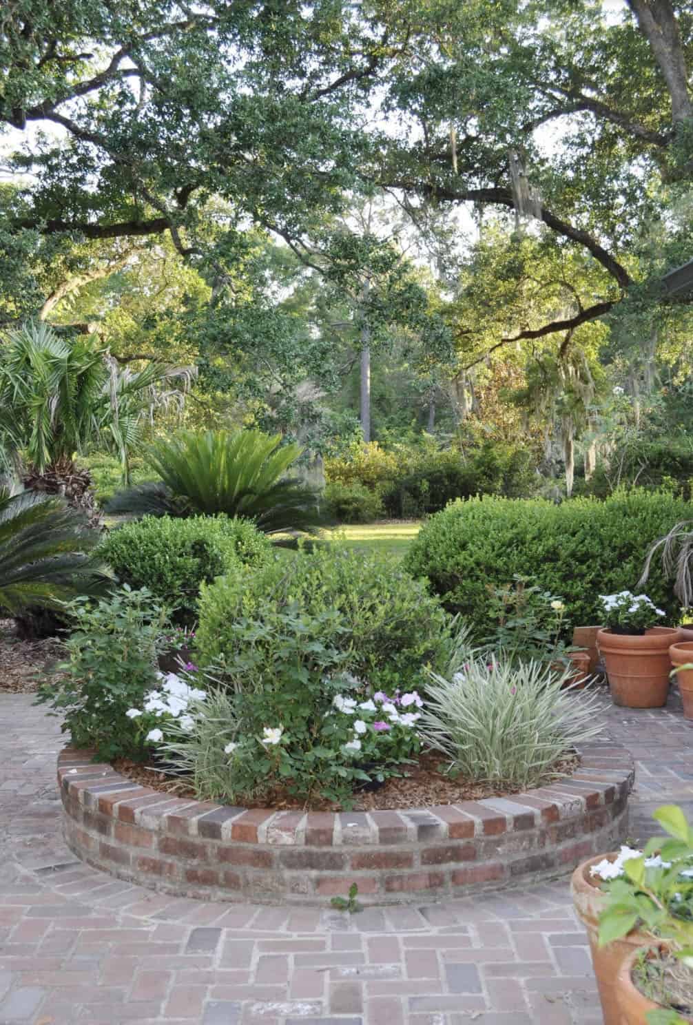 circular garden bed with a brick edge