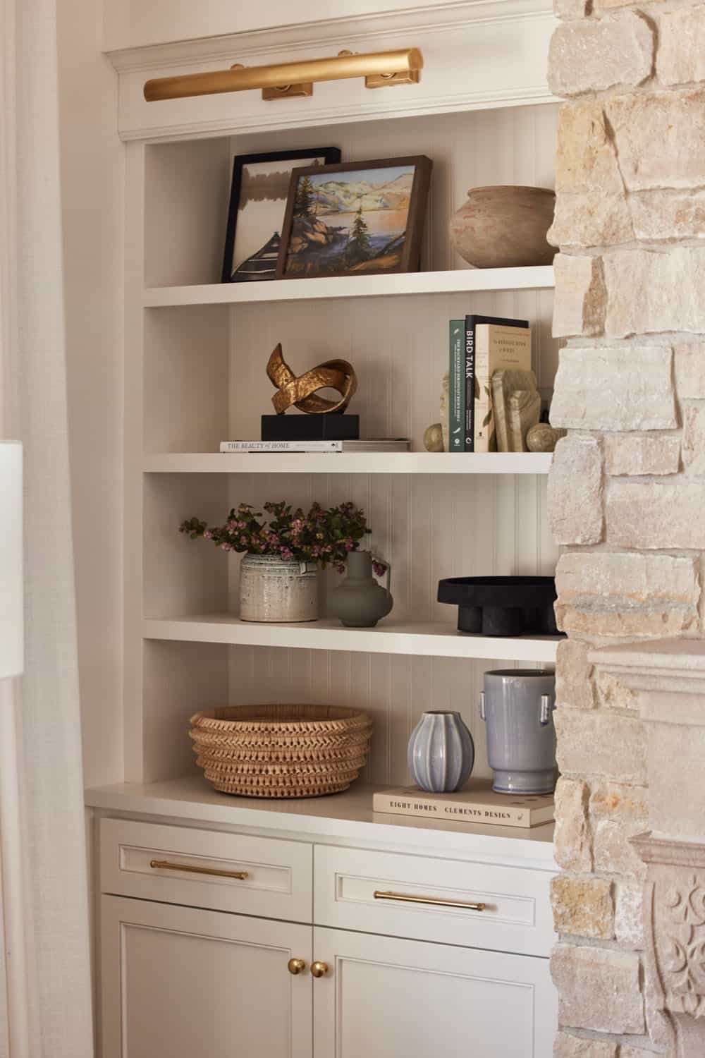 living room with open shelves and decor