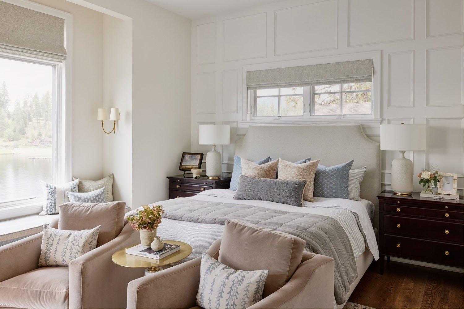 A bedroom with a bed, chair and window.