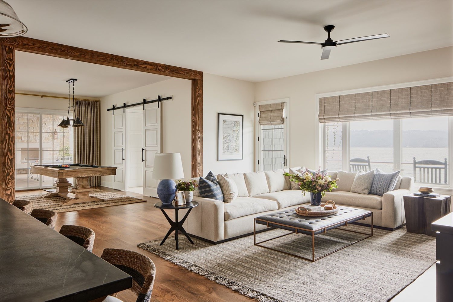 A family room with a table, sofa, and chairs.