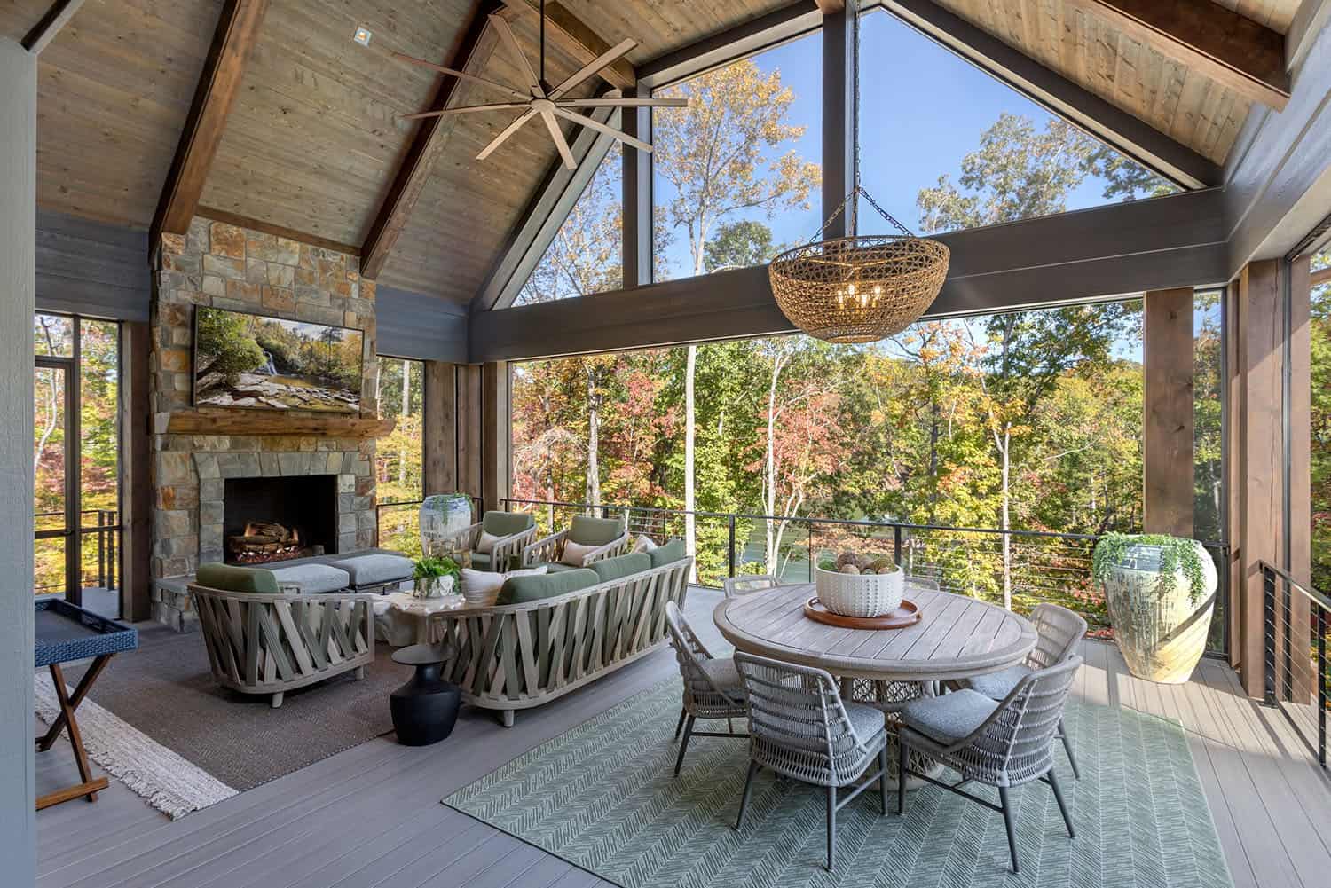 contemporary lake house covered porch with outdoor furniture