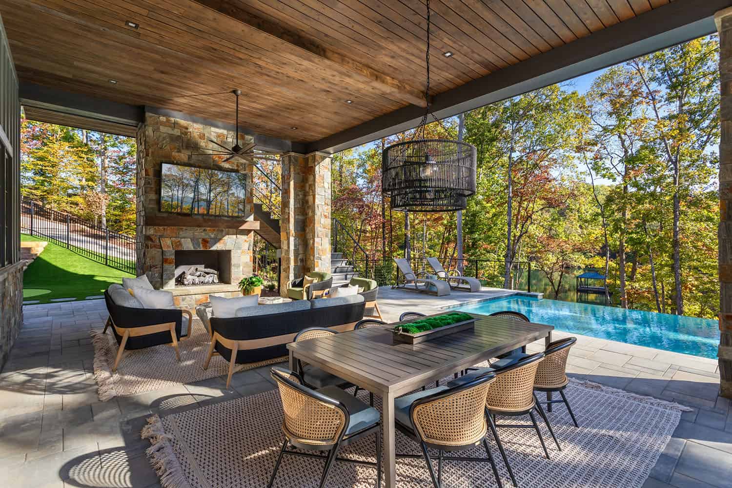 contemporary lake house exterior covered patio with outdoor furniture