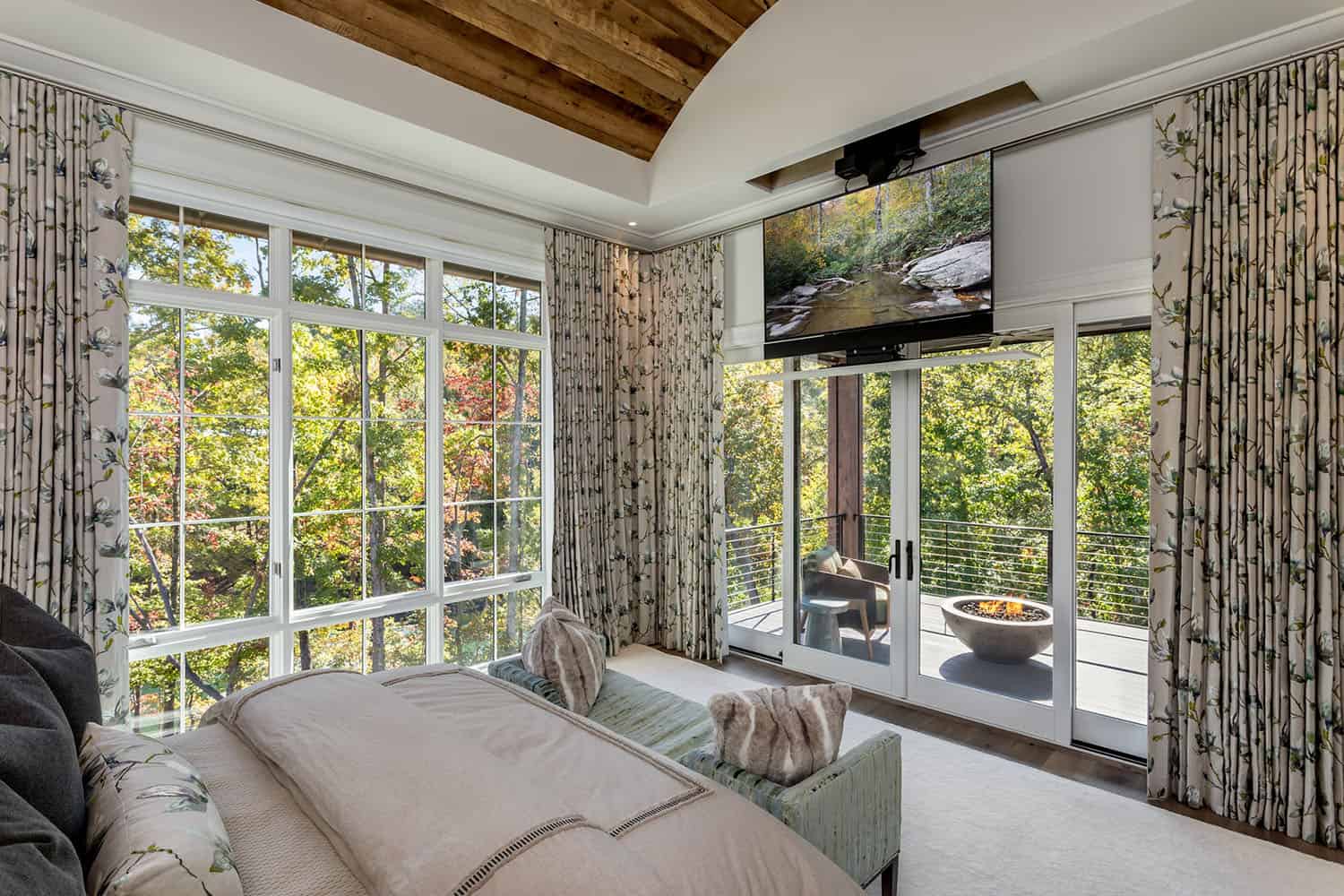 contemporary bedorom with a sliding glass door leading out to a private balcony