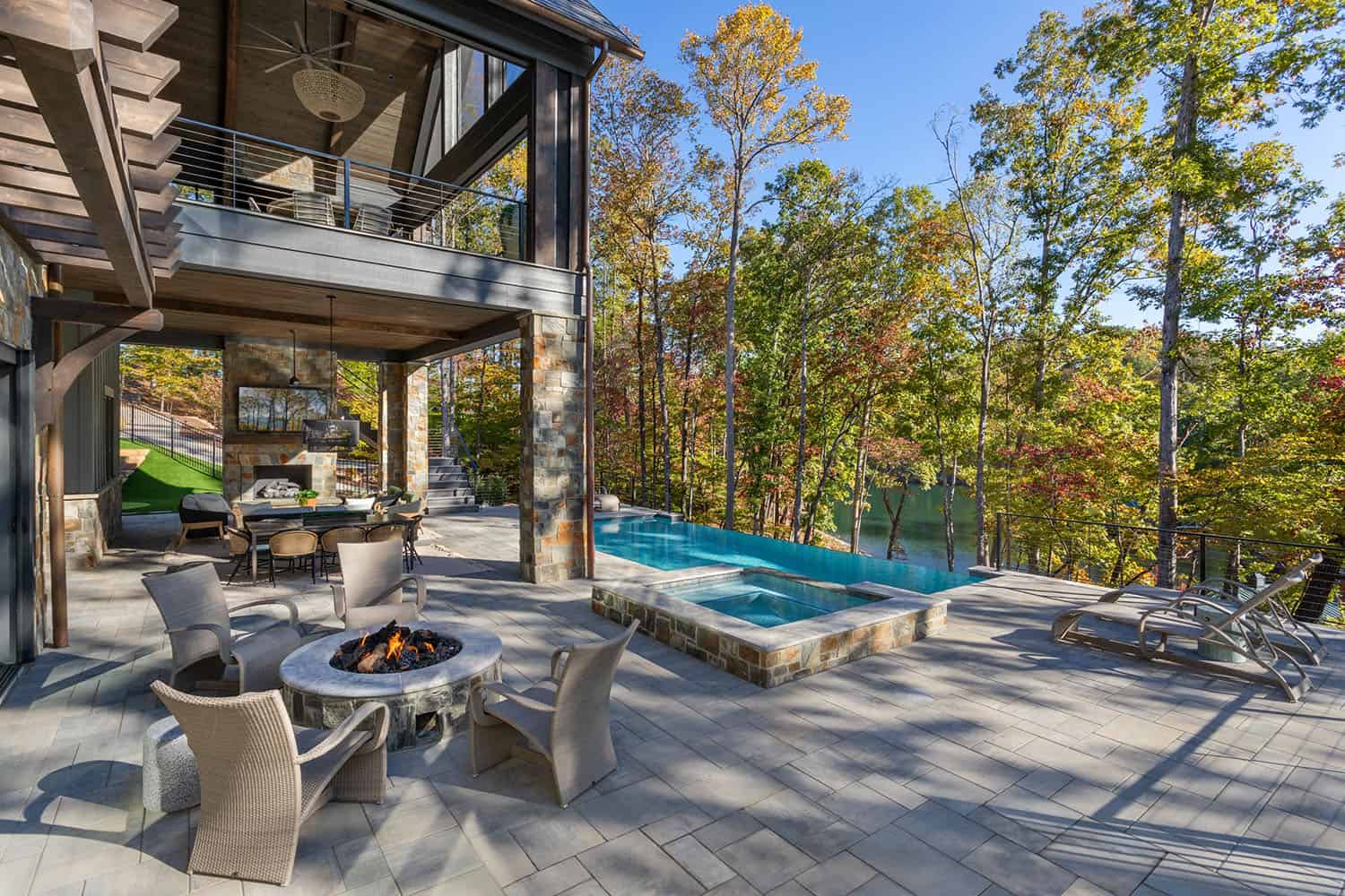 contemporary lake house exterior backyard view with a pool