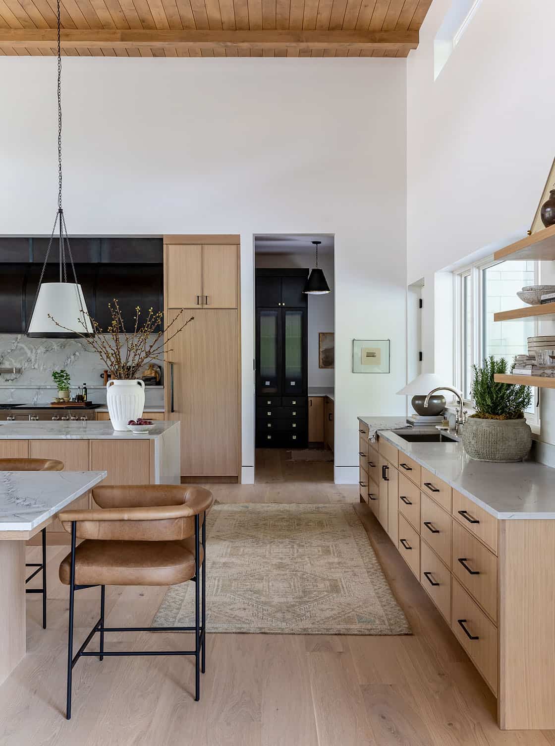 contemporary kitchen with a double island and counter stools