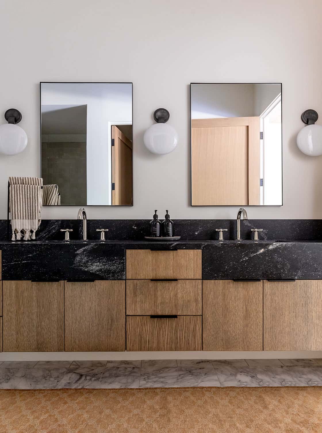 contemporary bathroom with dual sinks and mirrors