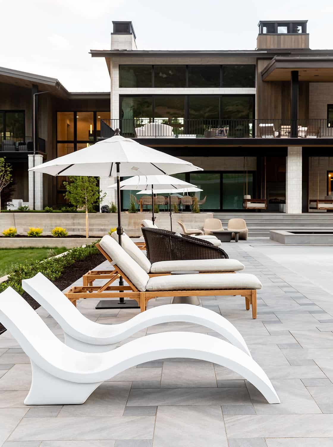 contemporary covered patio with chaise lounges