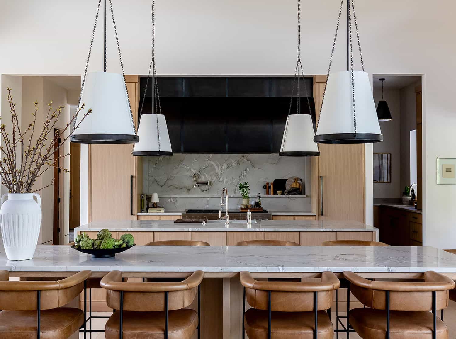 contemporary kitchen with a double island and counter stools