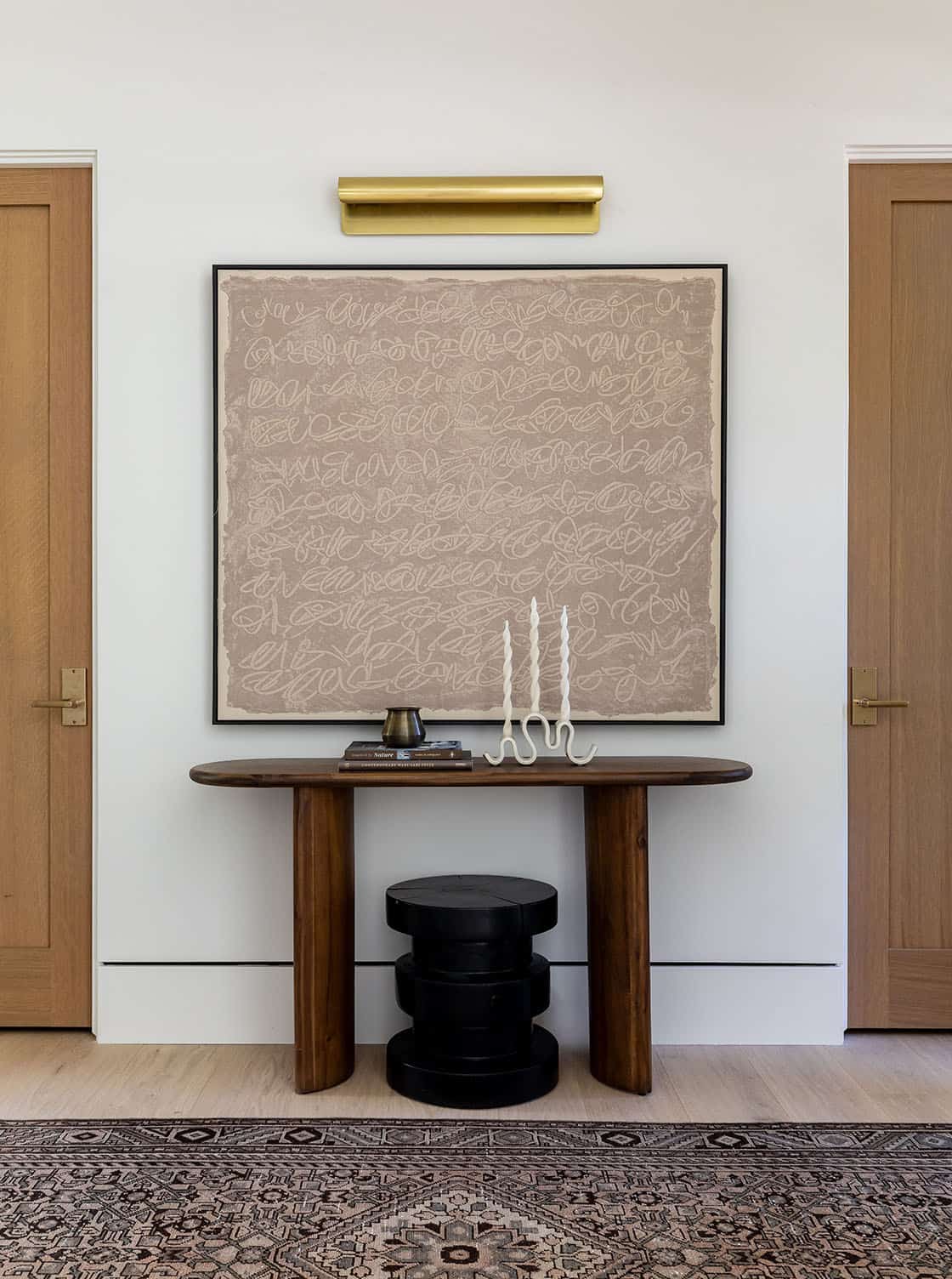 contemporary hallway with a console table