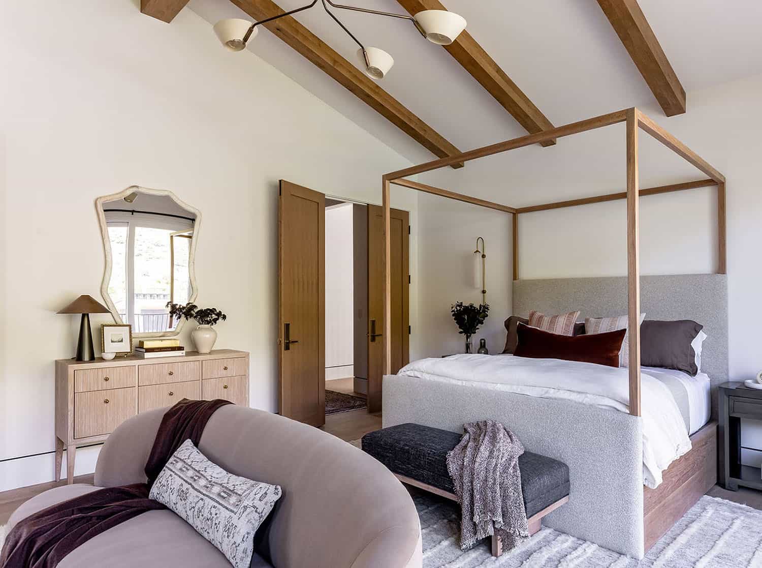 contemporary bedroom with a vaulted ceiling