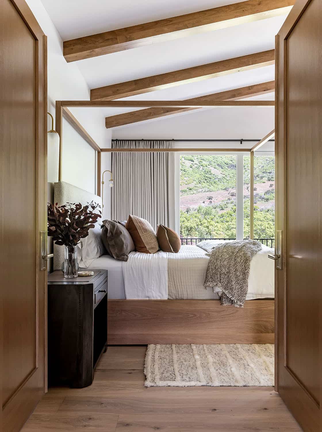 contemporary bedroom with a vaulted ceiling