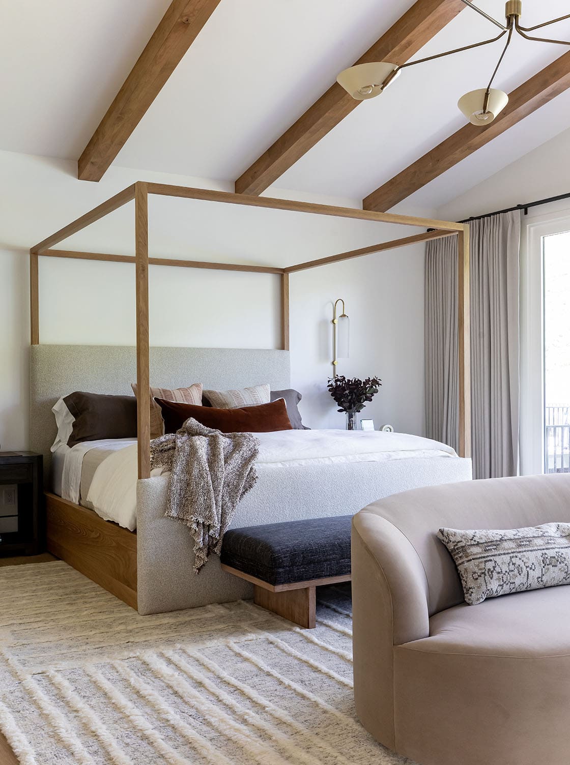 contemporary bedroom with a vaulted ceiling