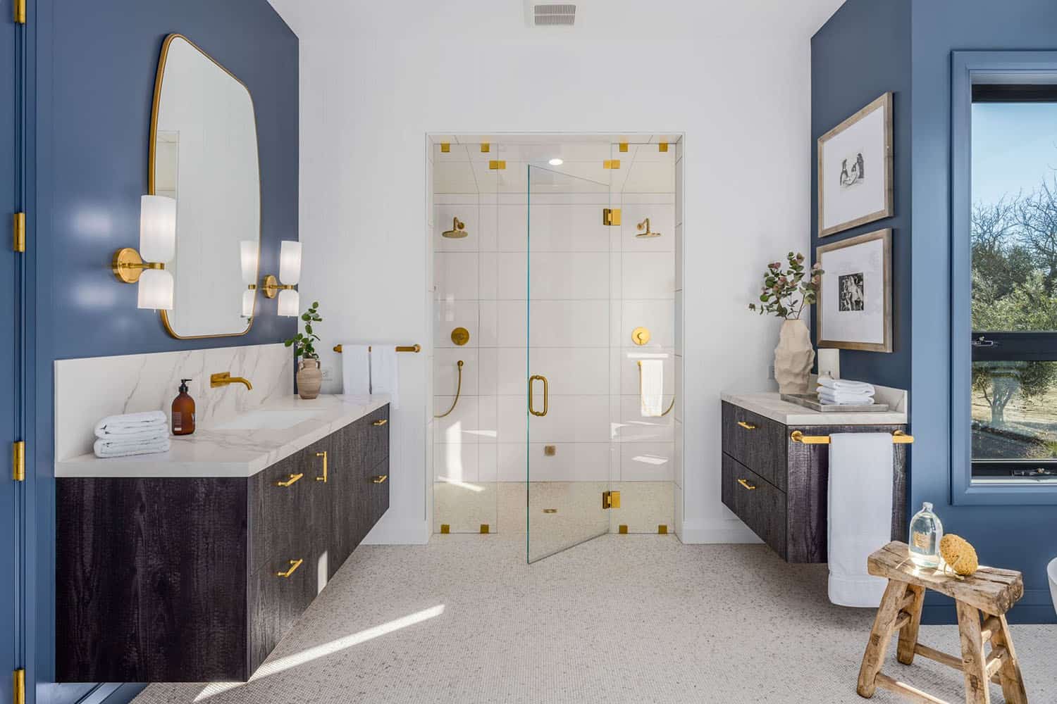 contemporary bathroom with dual vanities and a shower