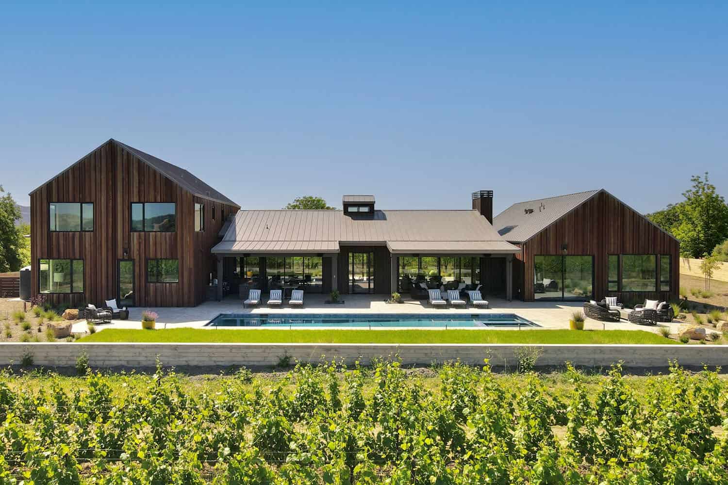 contemporary vineyard home exterior with a pool