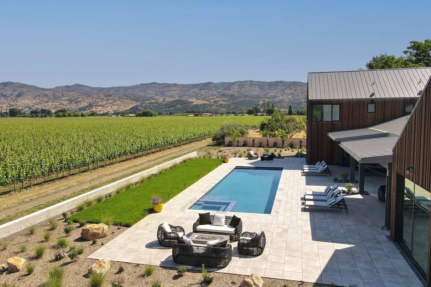 contemporary vineyard home exterior with a pool