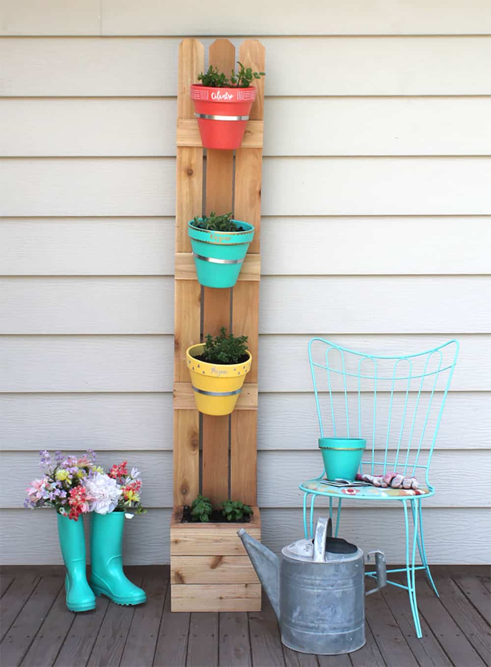 vertical planter with fence slats and terracotta pots
