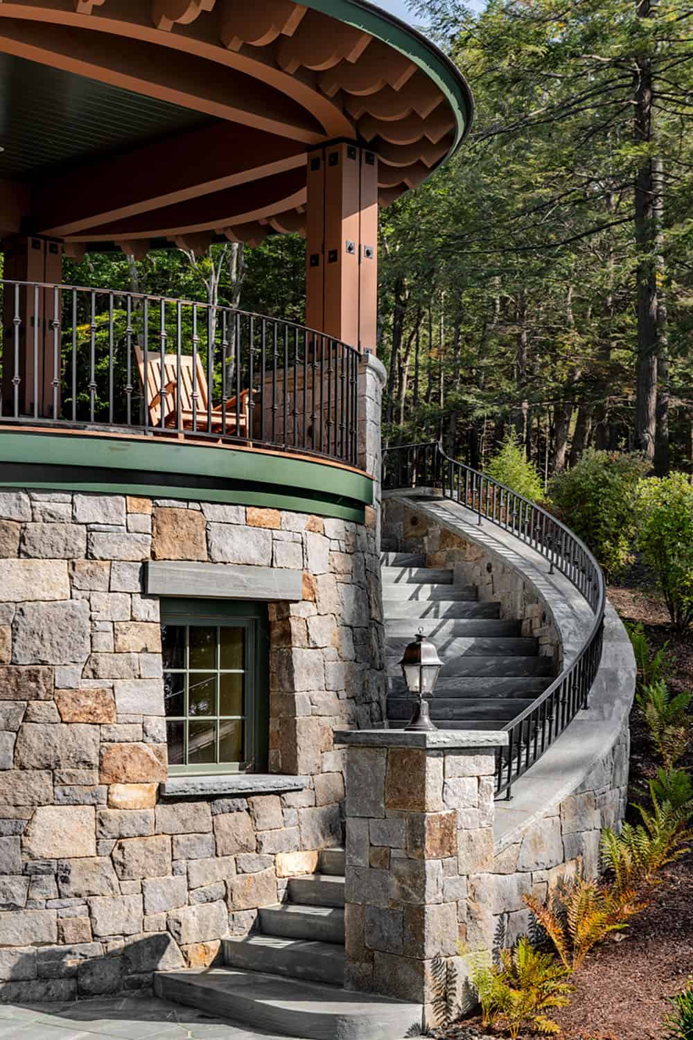 lake house exterior with a curved staircase