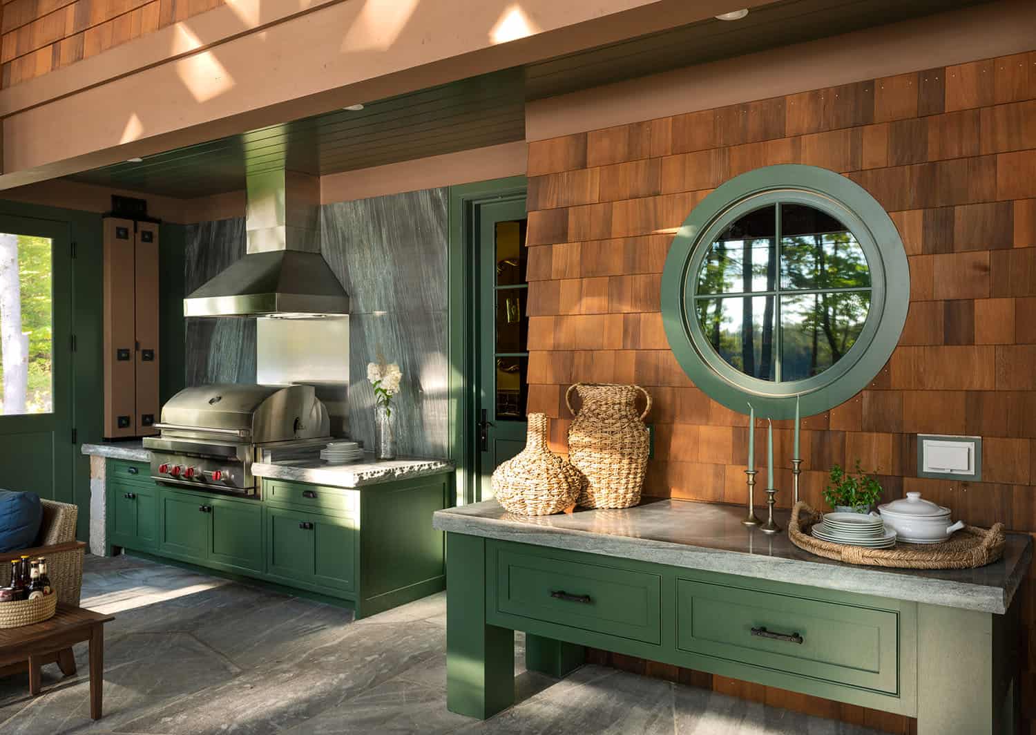 rustic covered porch with a built-in grill