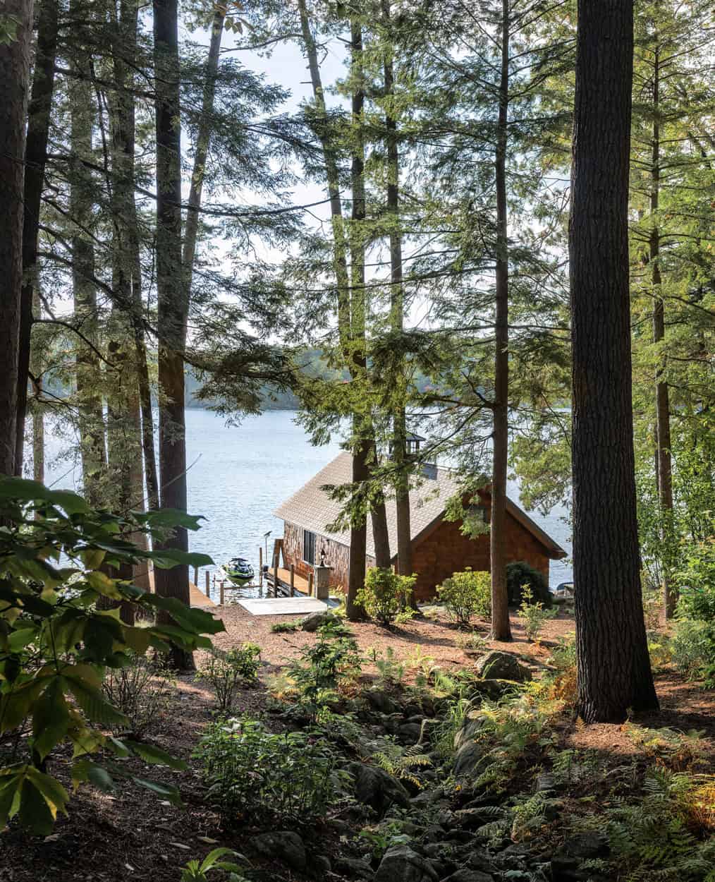 lake house exterior with woods