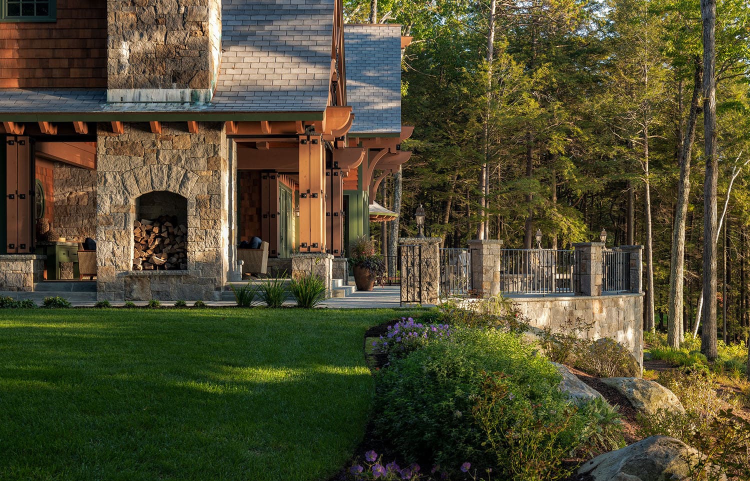 lake house exterior backyard view with a fireplace