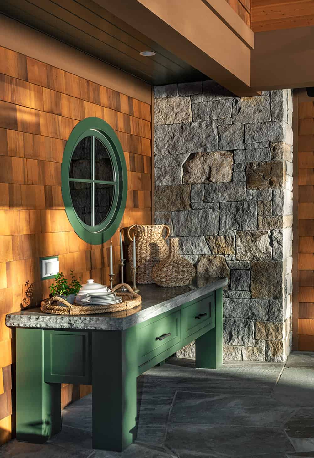 rustic covered porch with a built-in grill