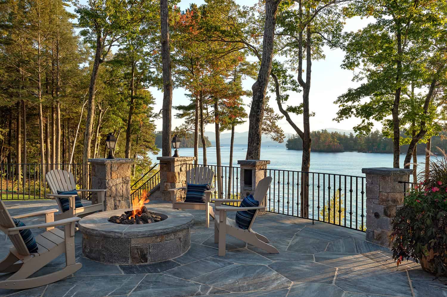 rustic lake house terrace with a fire pit