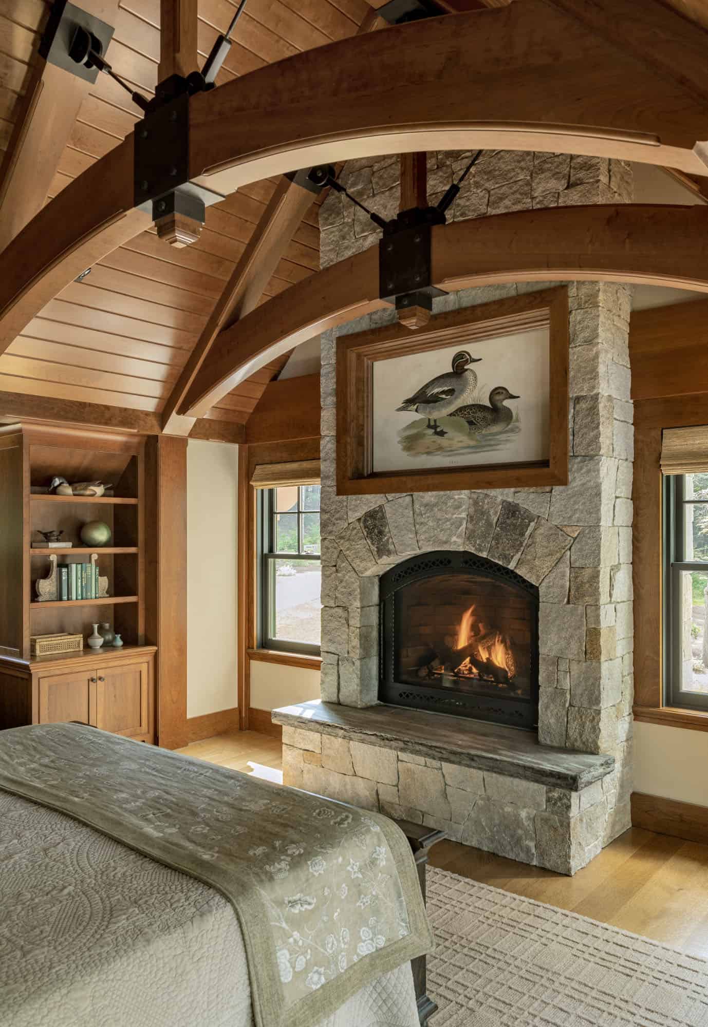 rustic bedroom with a fireplace