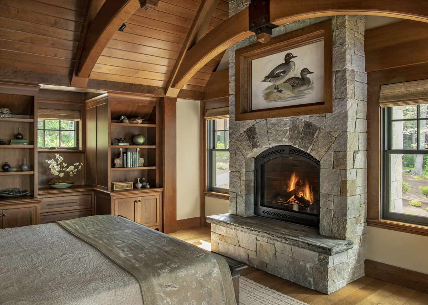 rustic bedroom with a fireplace