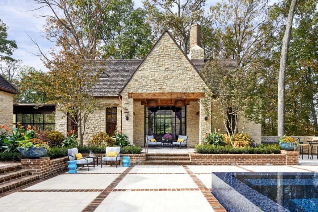 English Cotswold-inspired home exterior backyard patio