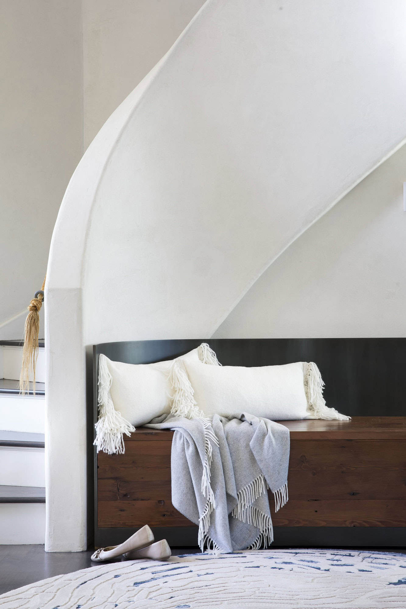 contemporary staircase with a lounge chair 