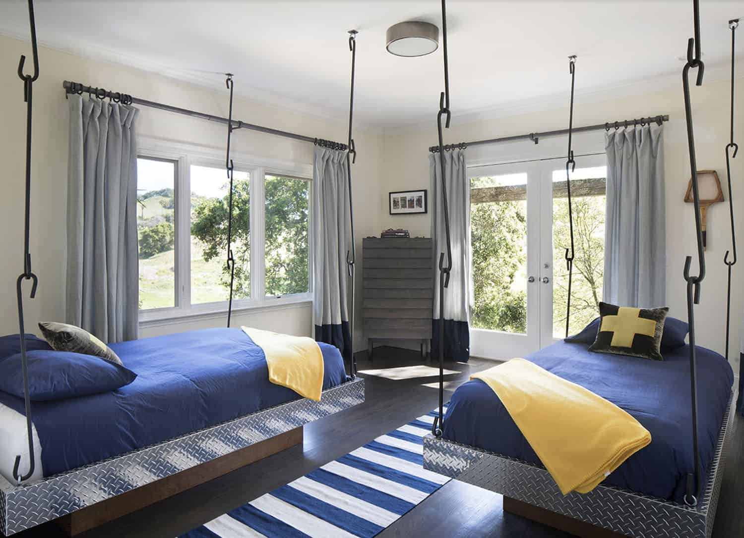 contemporary bedroom with hanging beds