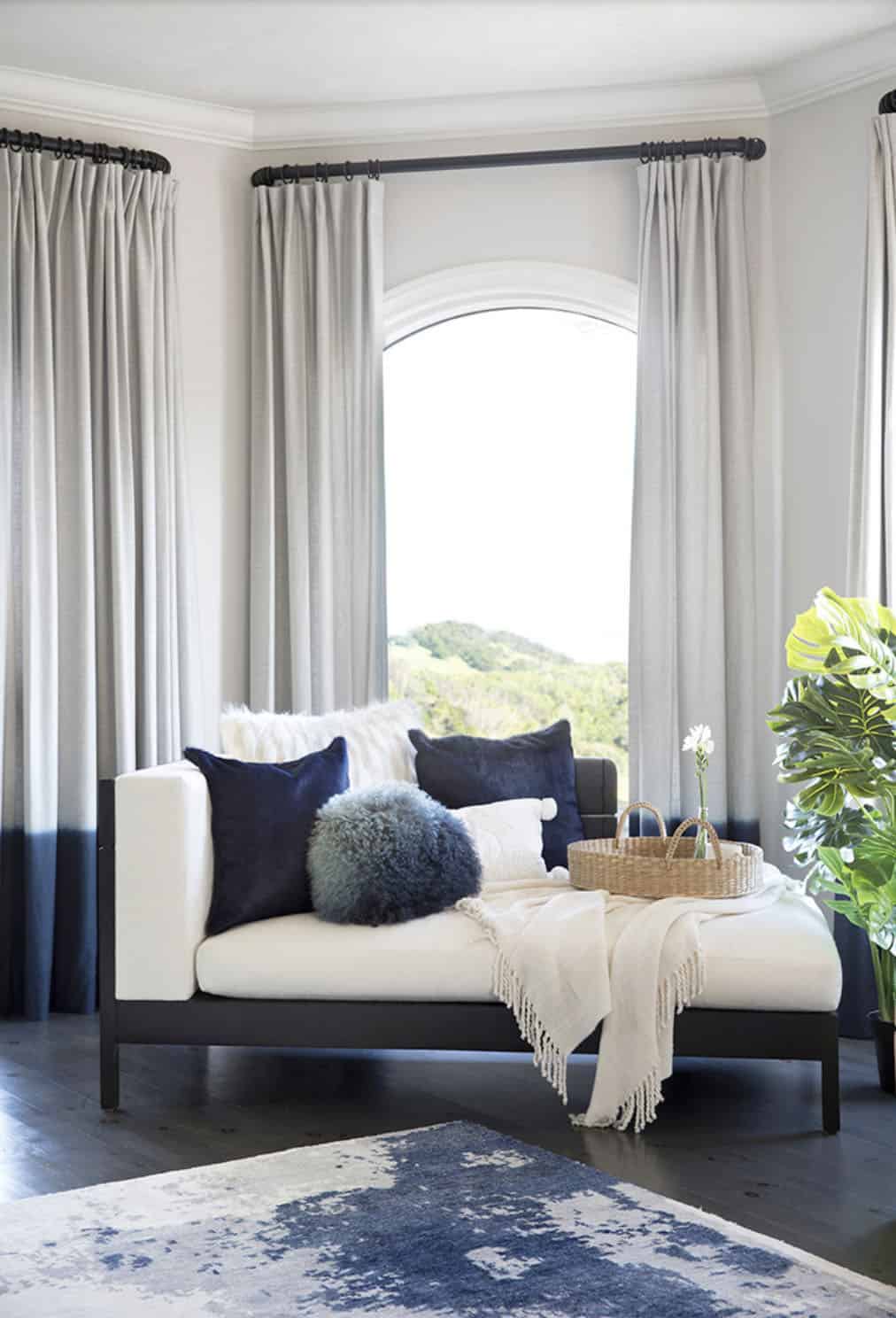 contemporary bedroom with a chaise lounge