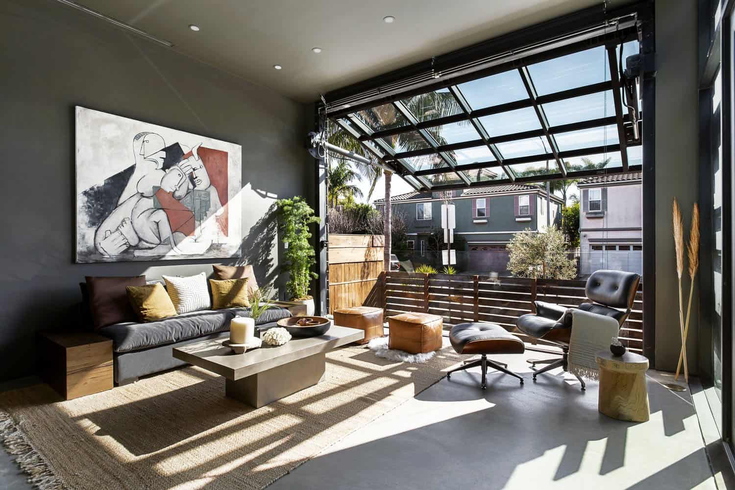 industrial style living room with a hydraulic glass door