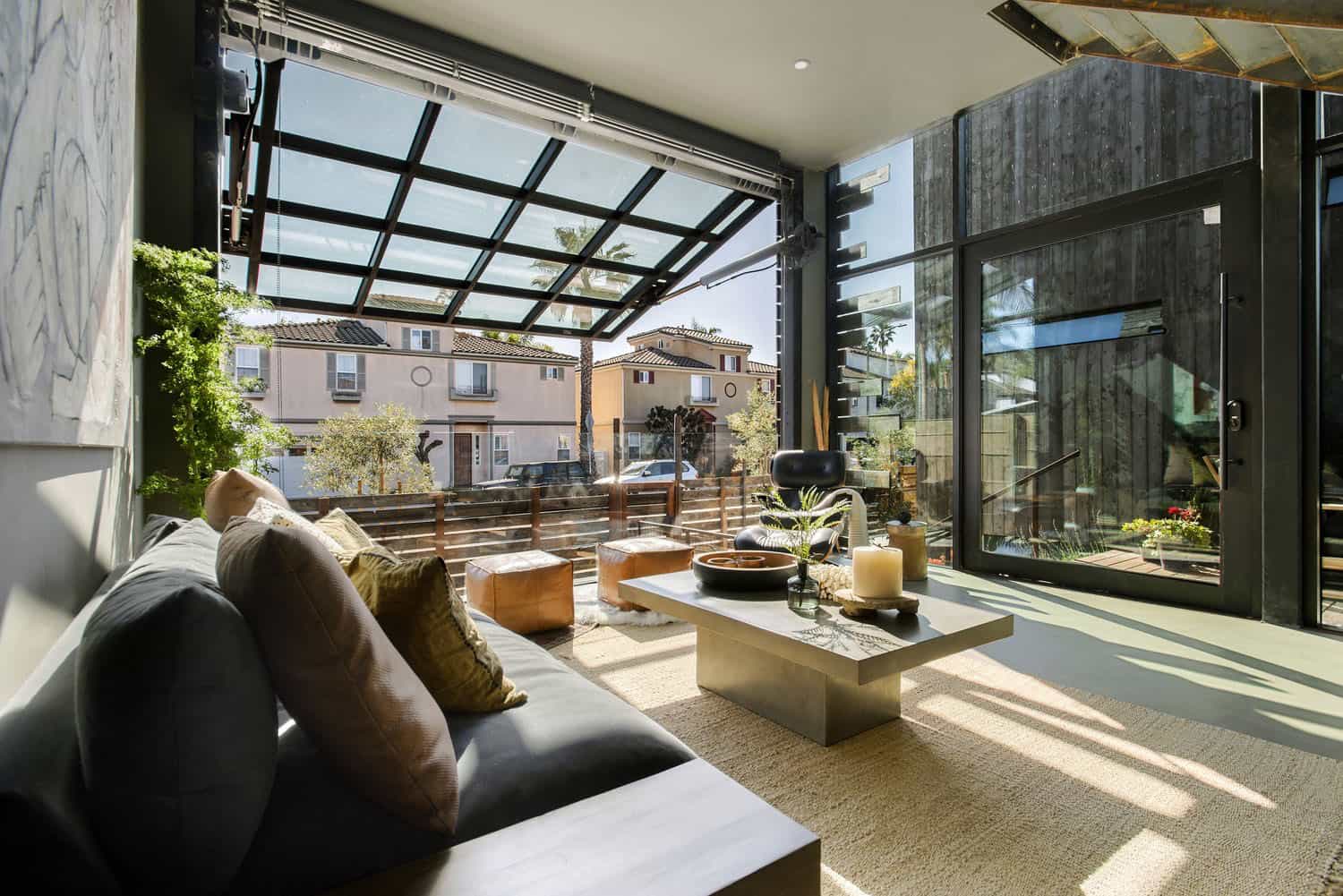 industrial style living room with a hydraulic glass door
