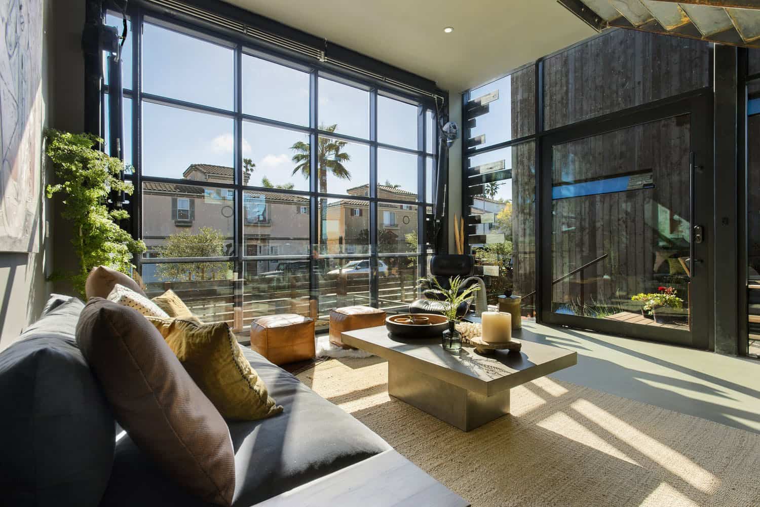 industrial style living room with a hydraulic glass door