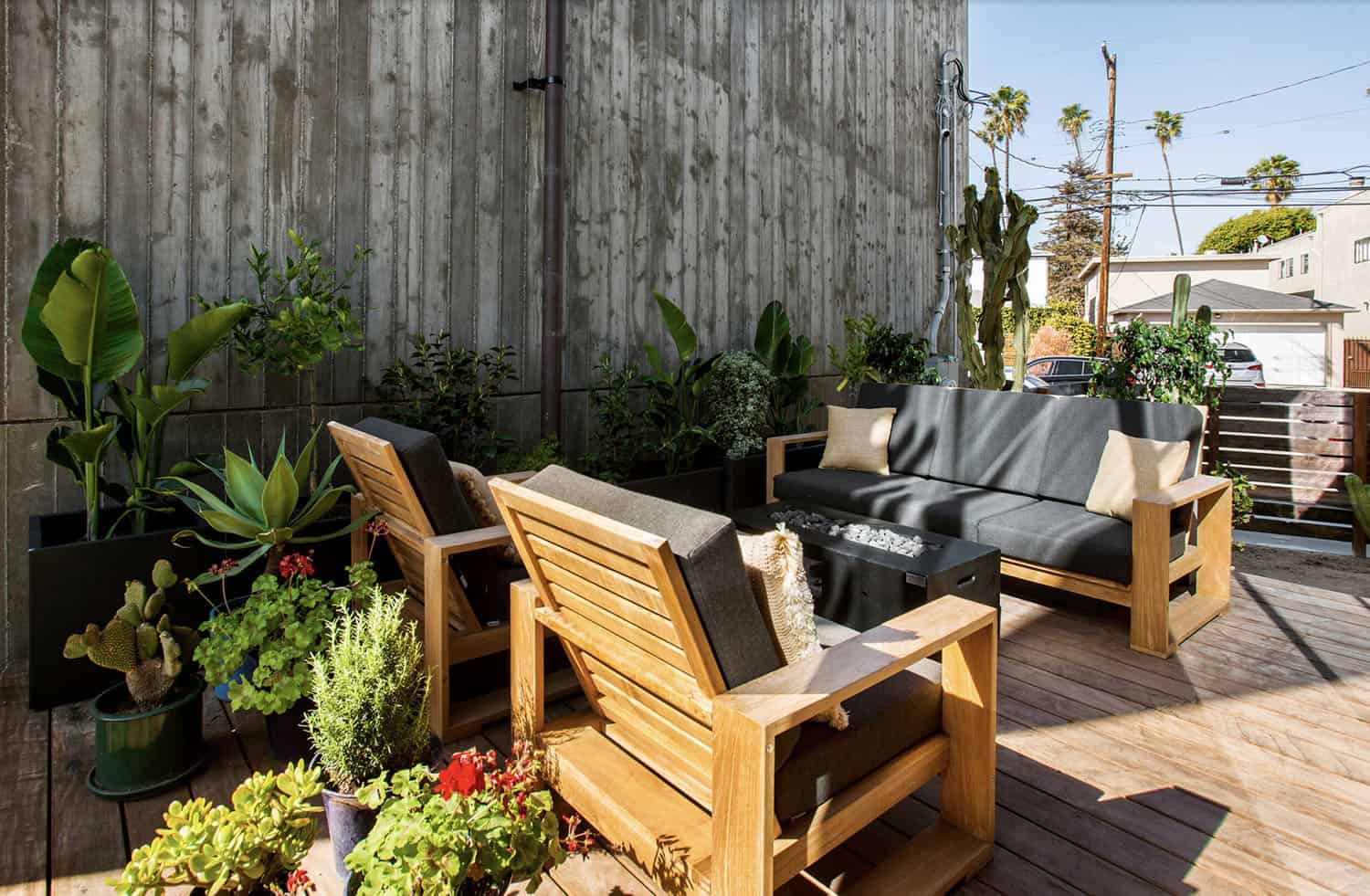 industrial style house exterior patio with outdoor furniture