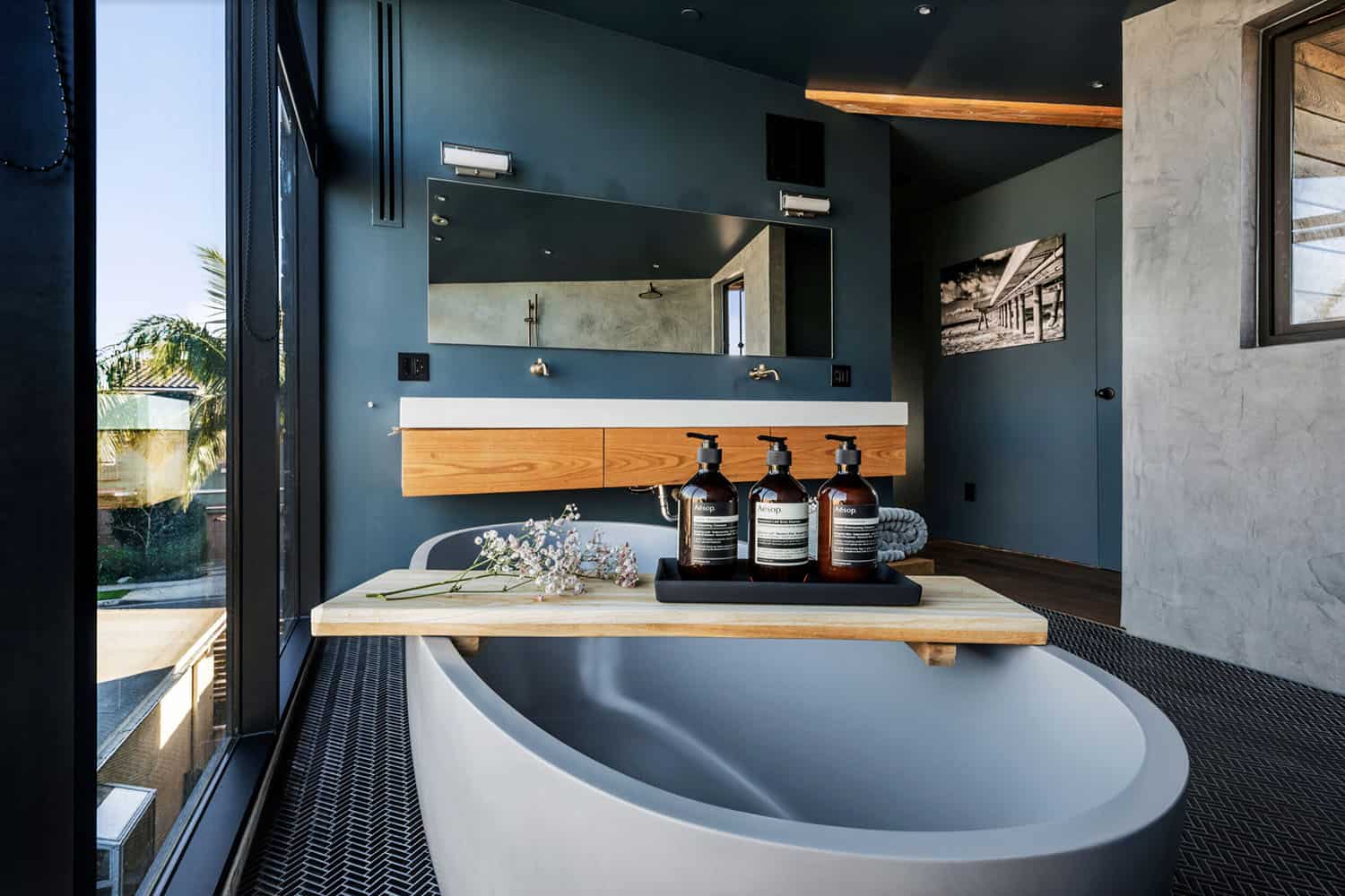 industrial style bathroom with a freestanding tub