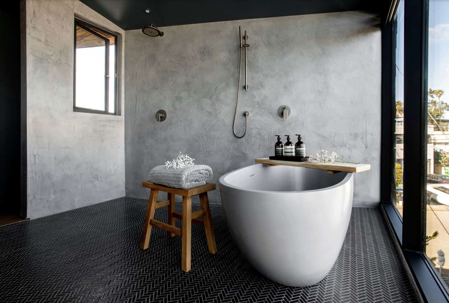 industrial style bathroom with a freestanding tub