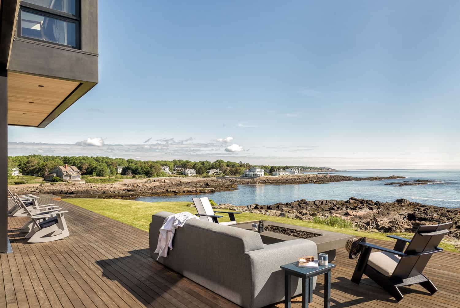 modern coastal home exterior deck with a water view