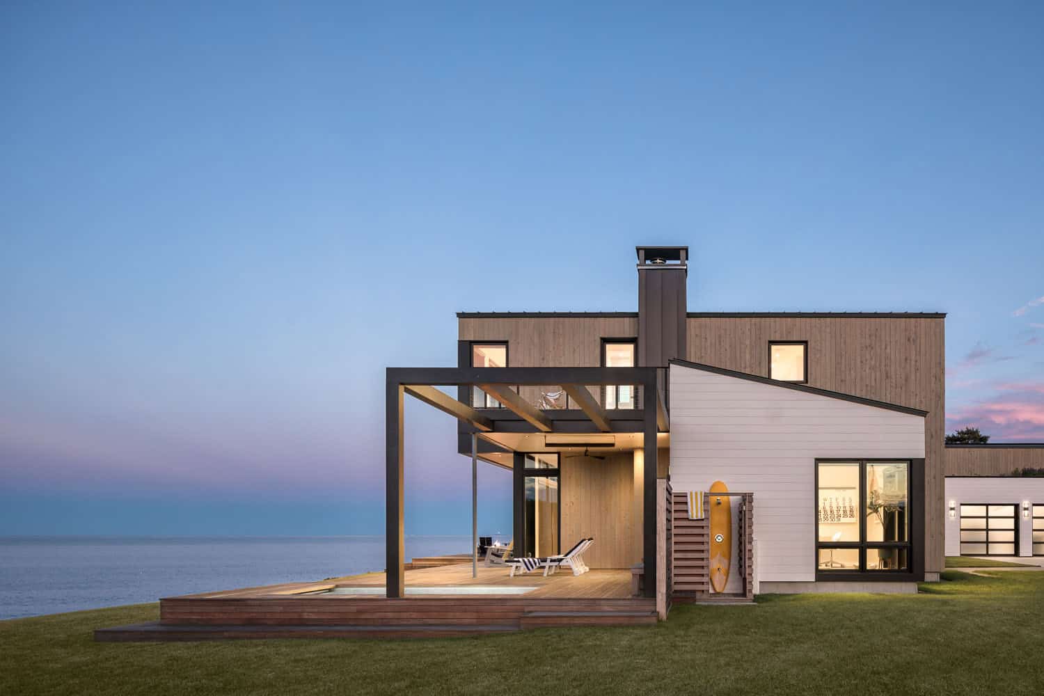 modern coastal home exterior at dusk