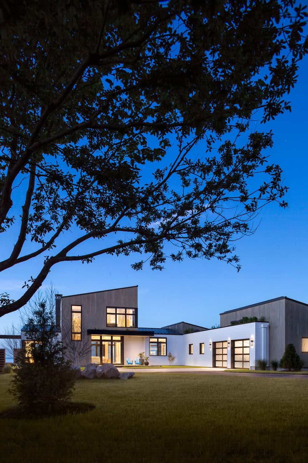 modern coastal home exterior at dusk