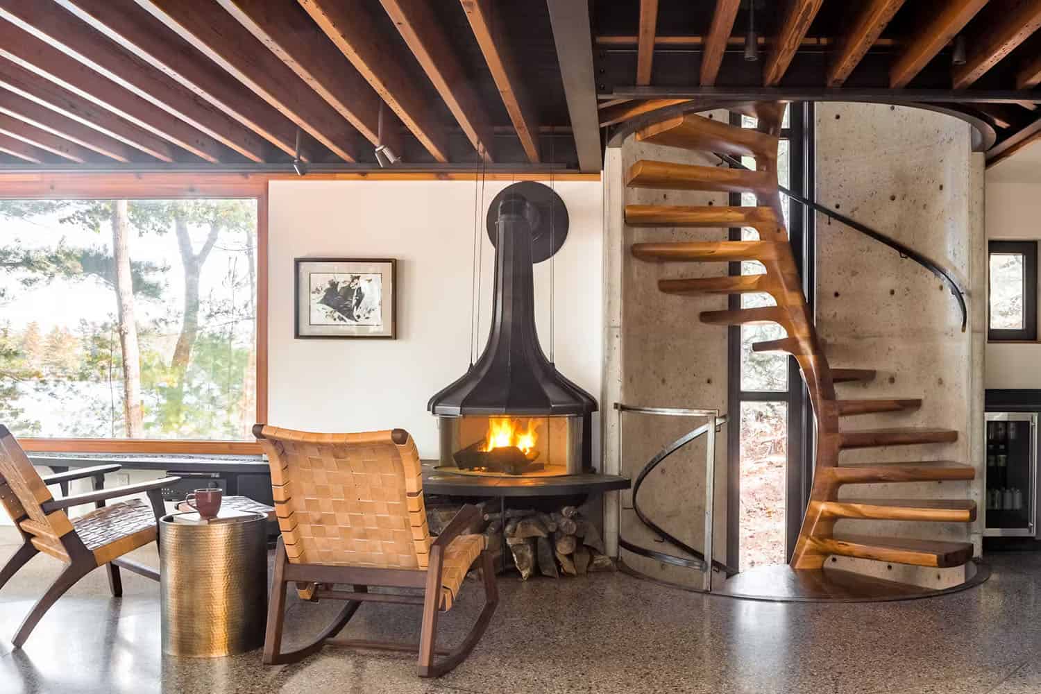 modern living room with a wood-burning stove and spiral wood staircase